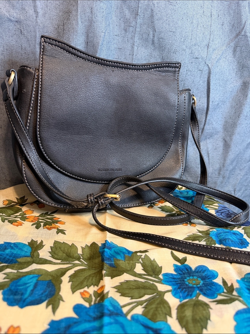 Elizabeth and James Black Leather Saddle Crossbody with Gold Hardware